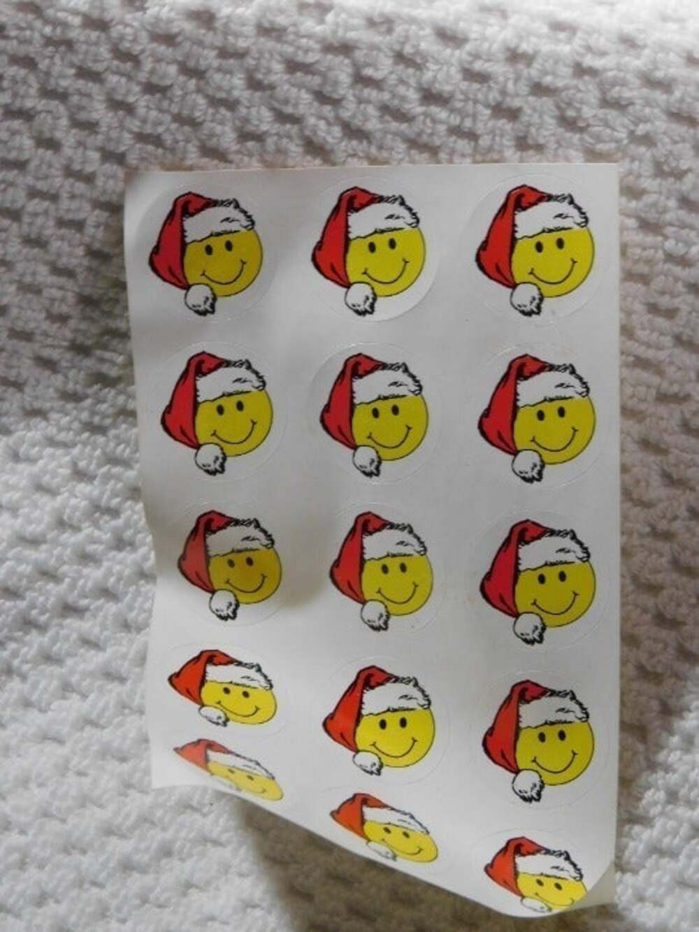 one Smile Face sticker sheet with Santa hat